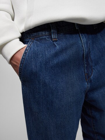 Loosefit Jeans con pieghe di Pull&Bear in blu