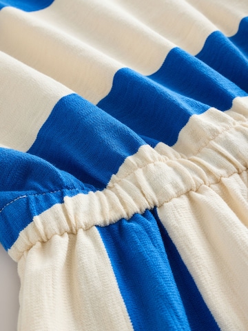 Next Kezeslábas - kék