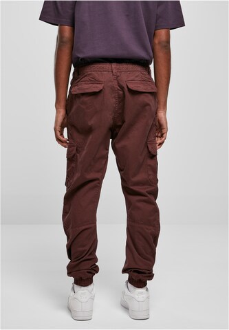 Urban Classics Tapered Cargo Pants in Red