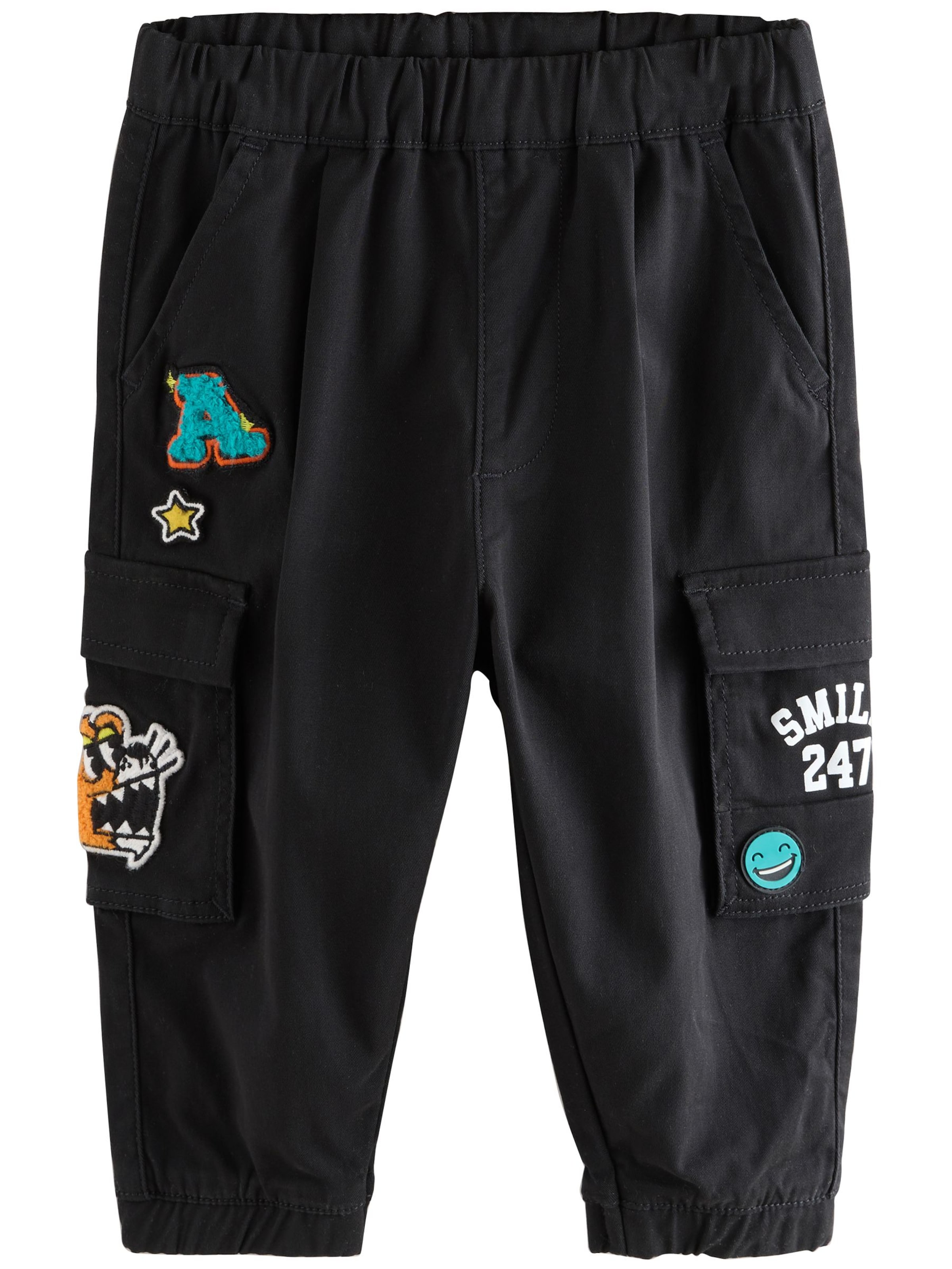 Next Tapered Trousers in Black: front