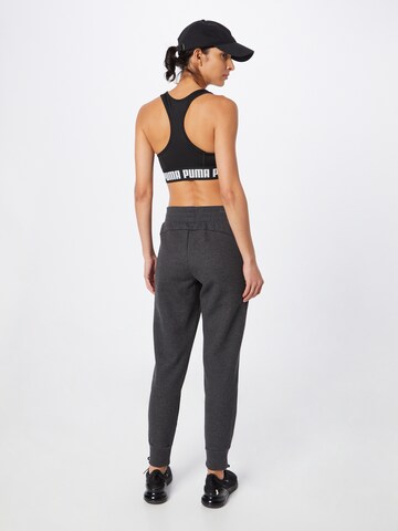 Effilé Pantalon de sport 'Essentials' PUMA en gris