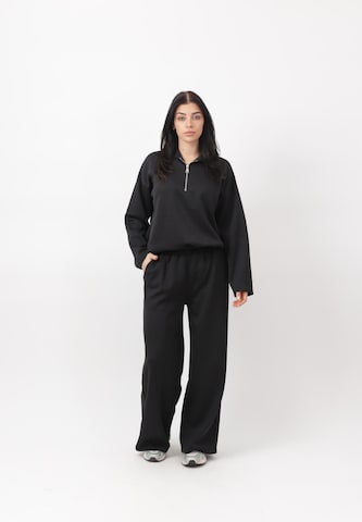 Elara Joggingdragt i sort: forside
