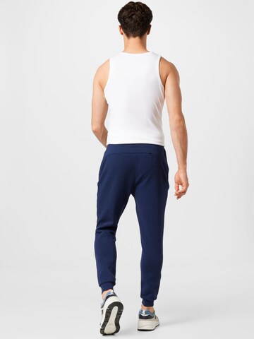 Tapered Pantaloni sport de la Superdry pe albastru