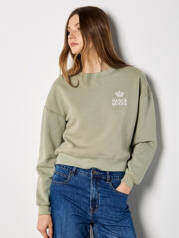 Sweat-shirt 'Dancing Queen' Apricot en vert : devant