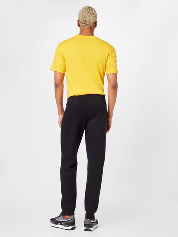 Champion Authentic Athletic Apparel Tapered Trousers in Black