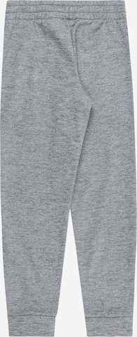 Effilé Pantalon de sport NIKE en gris