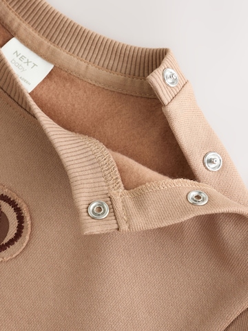 Set Next en marron