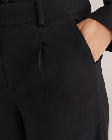 Wide leg Pantaloni con pieghe di WE Fashion in nero