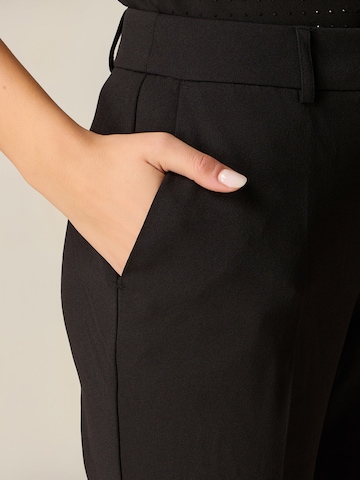 oltre - Tapered Pantalón en negro