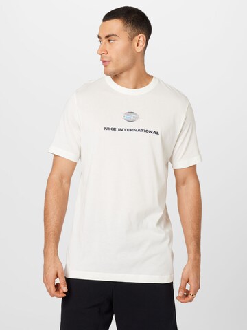 T-Shirt fonctionnel 'Heritage' NIKE en beige : devant
