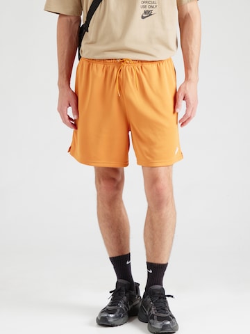 Nike Sportswear Regular Byxa 'CLUB FLOW' i orange: framsida