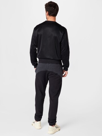 ADIDAS ORIGINALS Tapered Παντελόνι 'R.Y.V.' σε μαύρο