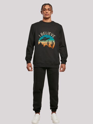 Sweat-shirt 'I Believe UFO Alien Sonnenuntergang' F4NT4STIC en noir
