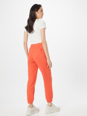 LACOSTE Tapered Broek in Oranje