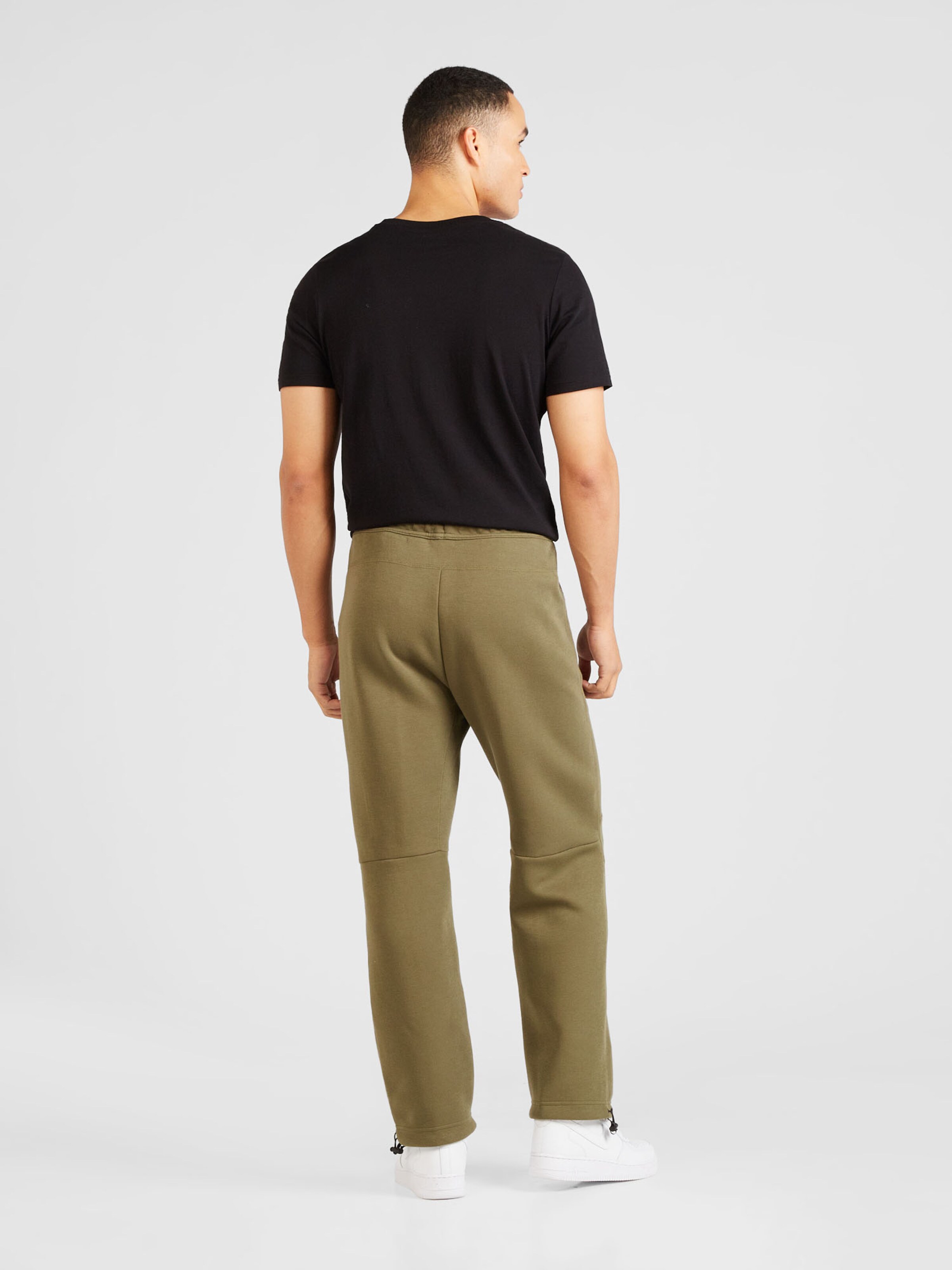 Nike Sportswear Loose fit Pants TECH FLEECE in Olive ABOUT YOU