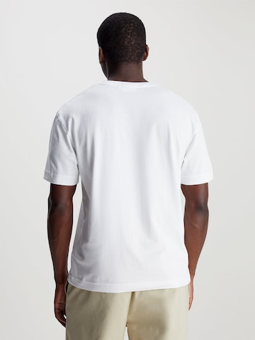 Calvin Klein Bluser & t-shirts i hvid