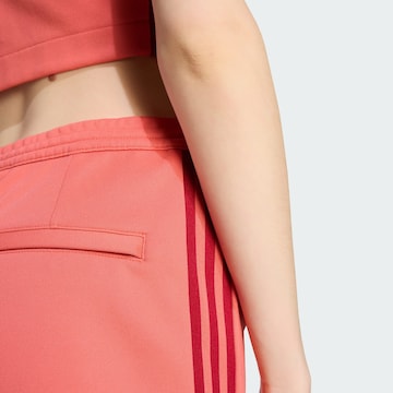 ADIDAS ORIGINALS Slim fit Trousers in Red