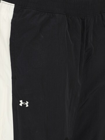 UNDER ARMOUR Szeroka nogawka Spodnie sportowe w kolorze czarny