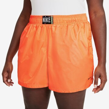 Nike Sportswear Loose fit Pants in Orange: front