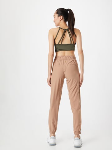 Athlecia Tapered Workout Pants 'Austberg' in Brown