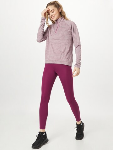 NIKE Skinny Sporthose in Lila