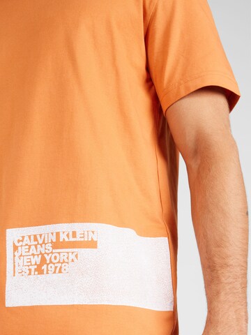 Calvin Klein Jeans Paita 'STENCIL' värissä oranssi