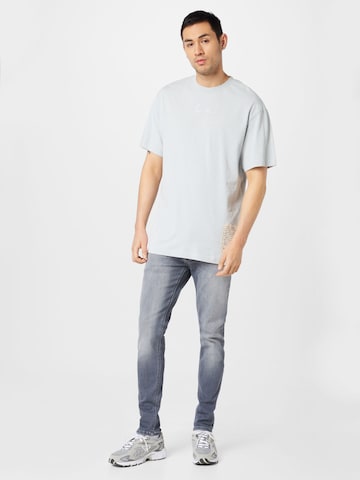 Karl Kani T-Shirt in Blau