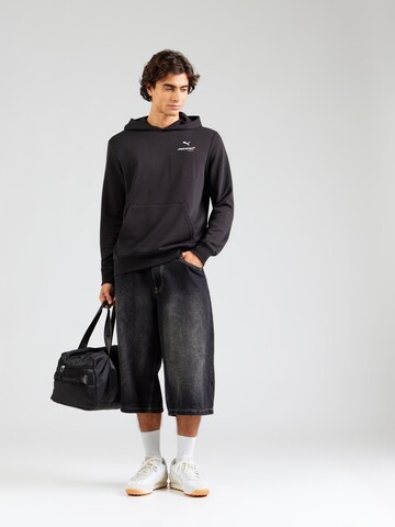 PUMASweater majica 'McLaren ESS' - crna boja