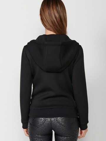 KOROSHI Välikausitakki värissä musta