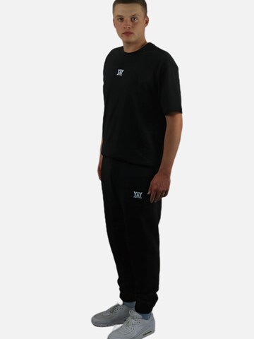 HEFTYKA Regular Sporthose‌ in Schwarz