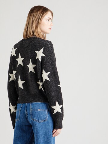 Pull-over Tommy Jeans en noir