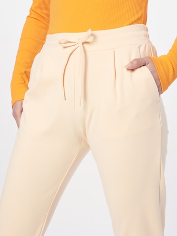 ICHI Kalhoty se sklady v pase 'KATE' – oranžová