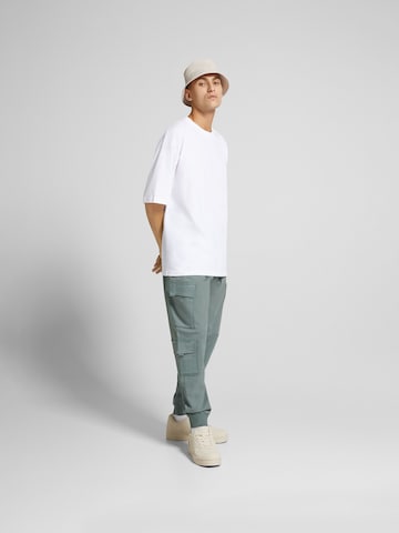 Bershka Tapered Cargo trousers in Blue