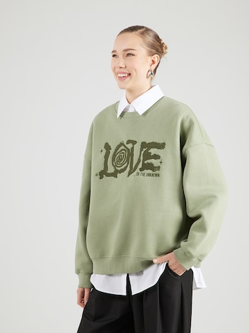 MADS NORGAARD COPENHAGEN - Sudadera en verde: frente
