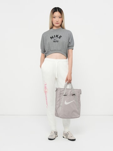 Tapered Pantaloni 'CLUB FLC' de la Nike Sportswear pe albastru