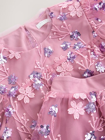 Set Next en rose
