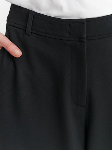 TATUUM - Loosefit Pantalón en negro