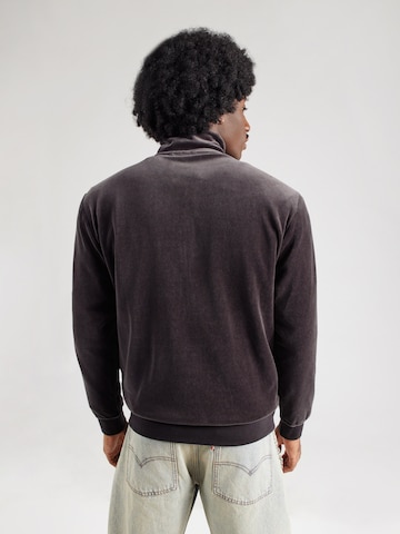 Veste de survêtement 'ESS' PUMA en noir