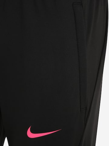 NIKE Slim fit Sports trousers in Black