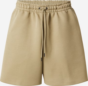 Nike Sportswear Loosefit Housut 'TCH FLC' värissä vihreä: etupuoli