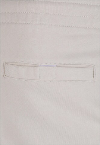 Tapered Pantaloni di Urban Classics in beige