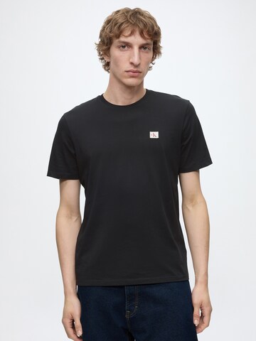 T-Shirt Calvin Klein Jeans en bleu : devant