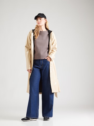 RAINS Преходно палто в бежово