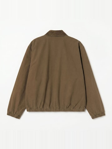 Giacca di felpa 'MADISON PITSTOP JACKET DARKBEECH/BLACK GARMENT DYED' di Carhartt WIP in marrone