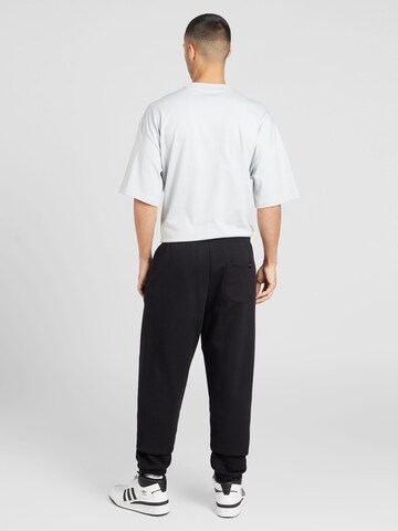 ALPHA INDUSTRIES Tapered Pants 'Essentials' in Black