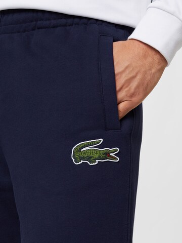 Tapered Pantaloni de la LACOSTE pe albastru