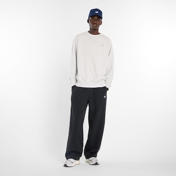 Loosefit Pantaloni sportivi 'Essentials Fleece' di new balance in nero