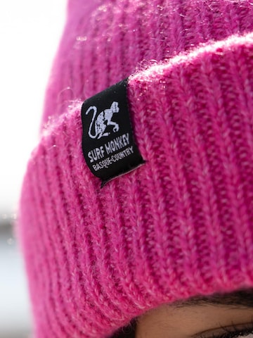 Bonnet Surf Monkey en rose