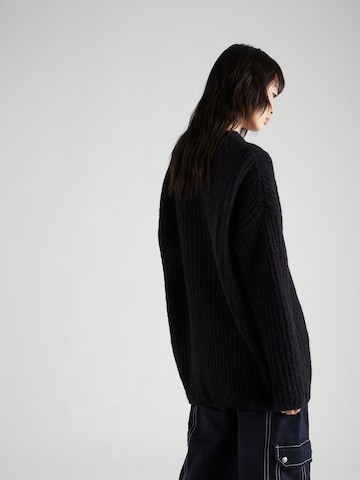 HUGO Oversized sweater 'Slogues' in Black
