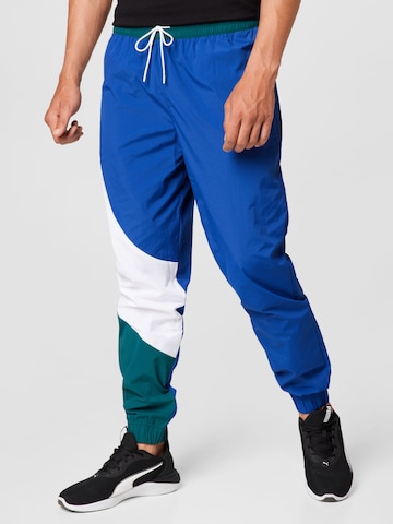 Effilé Pantalon de sport 'Clyde' PUMA en bleu : devant